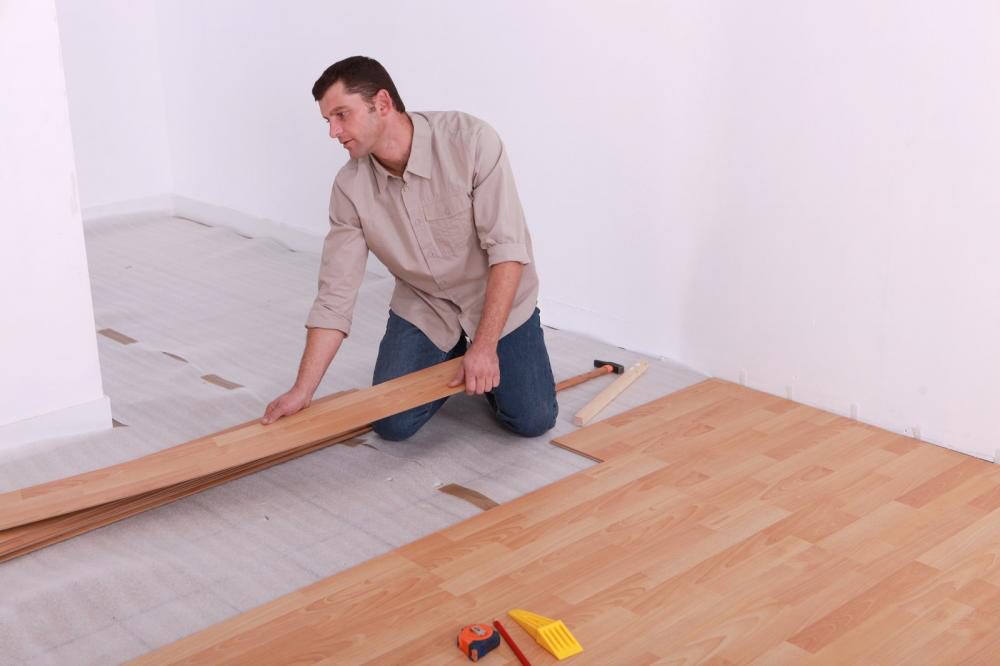 Man fitting engineered wood boards